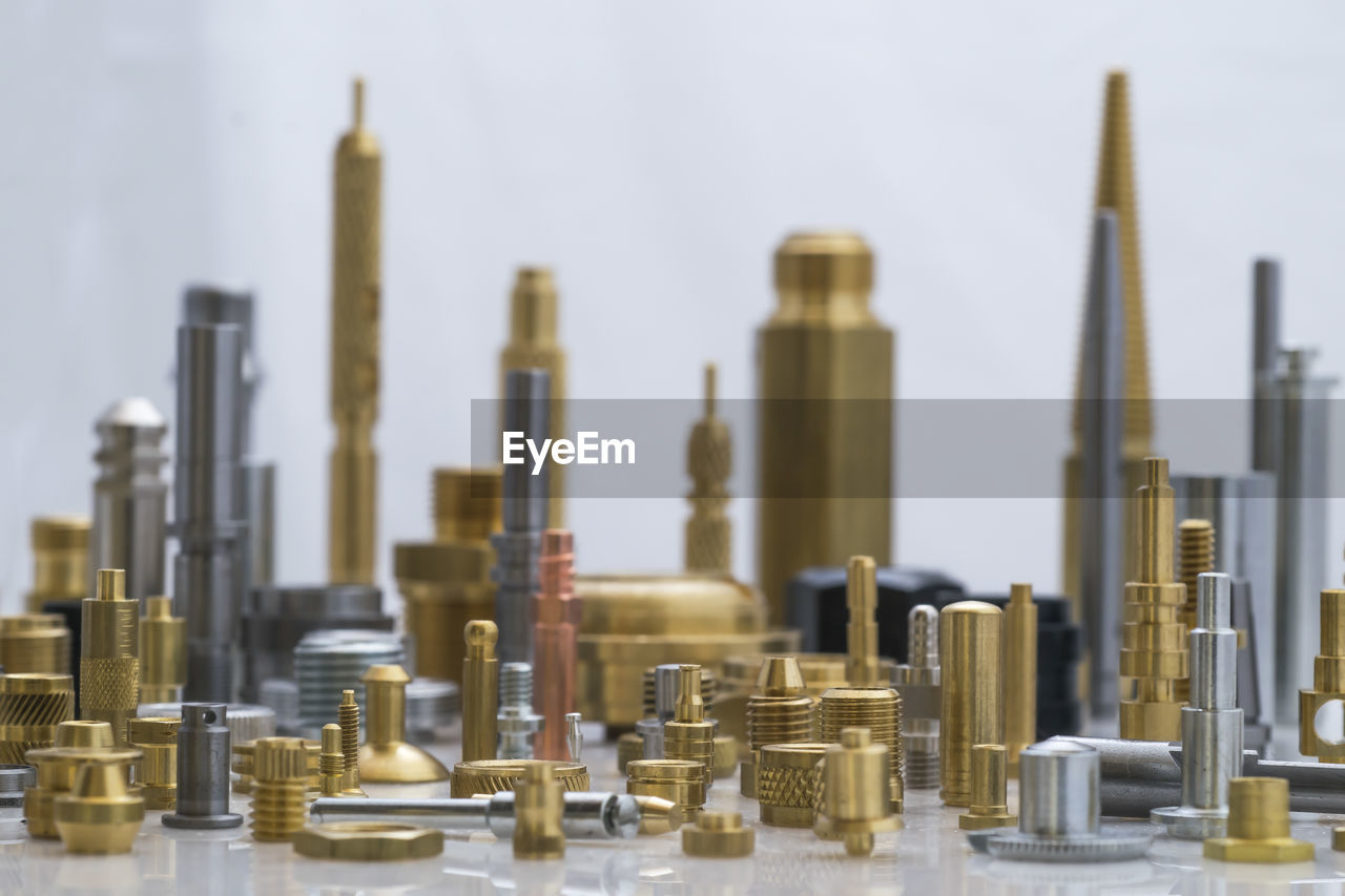 Close-up of city made with machine parts arranged on table