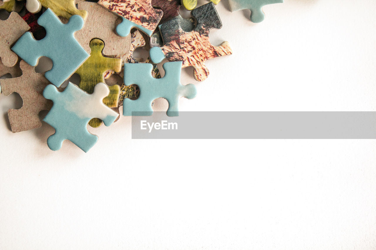 Puzzle. background with half jigsaw puzzle and half white copy space for your text and design