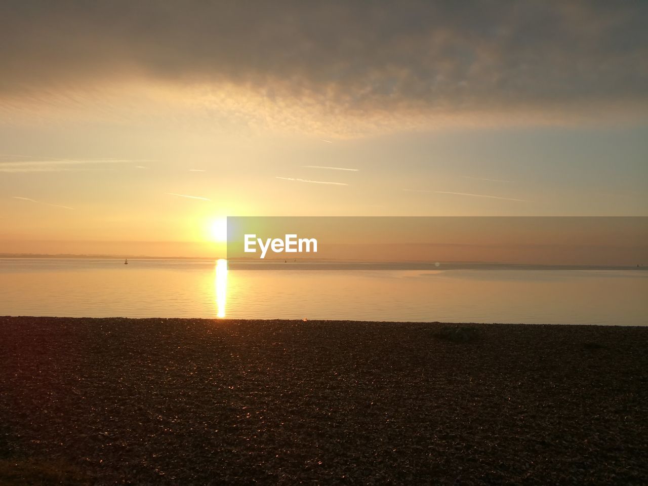 Scenic view of beach during sunrise