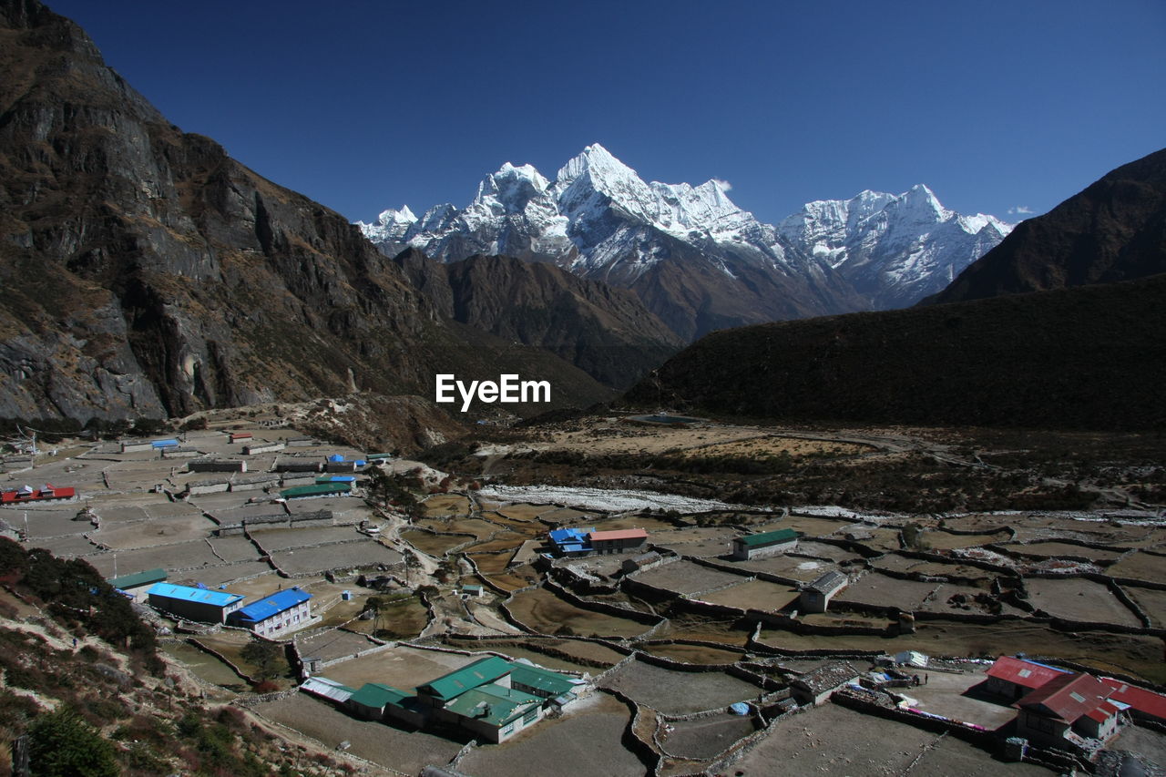 High angle view of snowcapped mountains against sky from thame, namche bazaar 