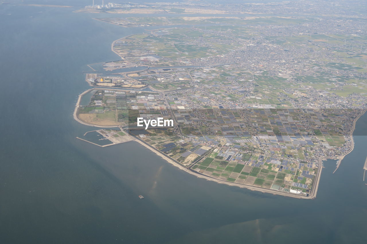 Aerial view of city by sea