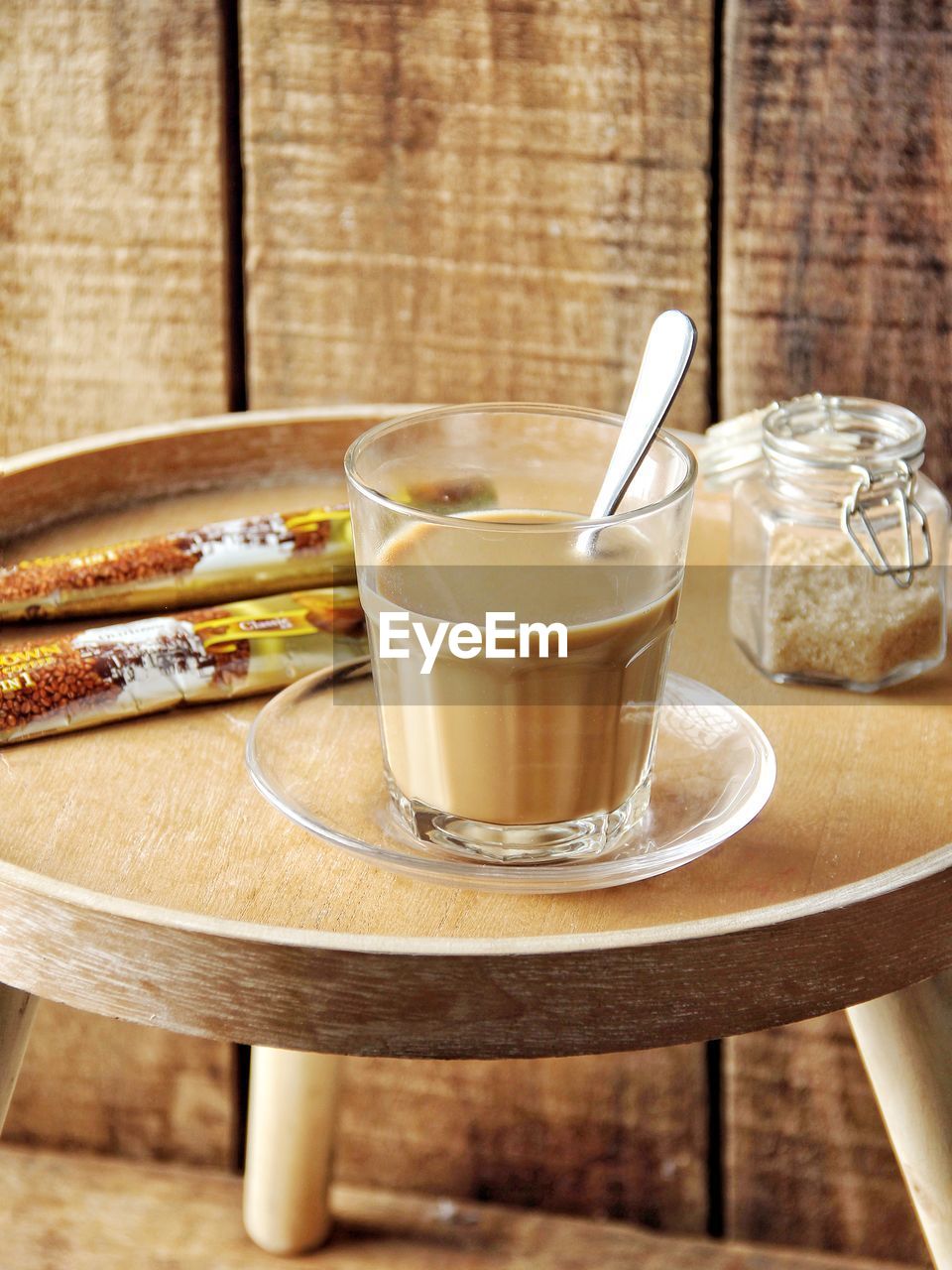 Milk coffee on wooden table