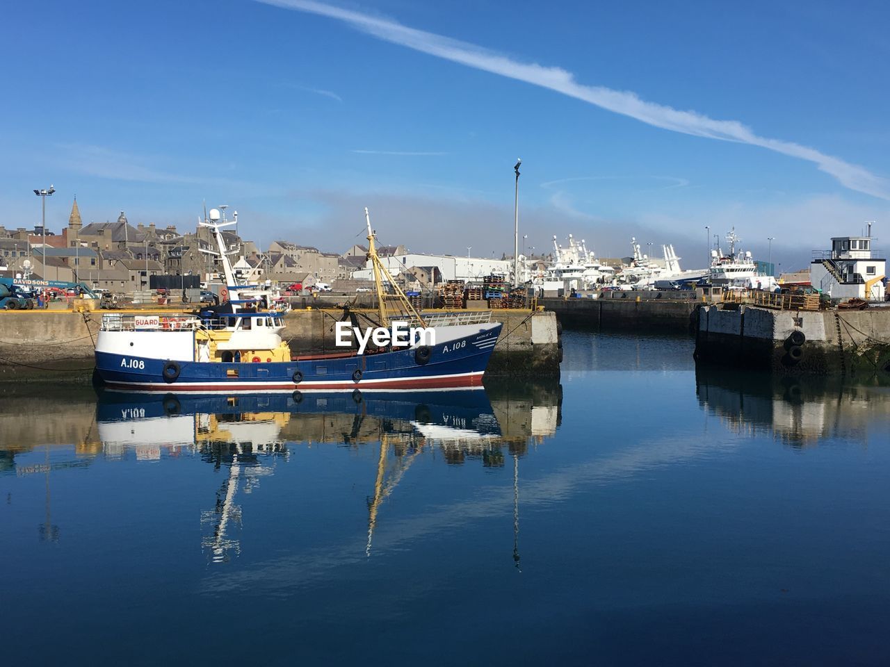BOATS MOORED IN HARBOR