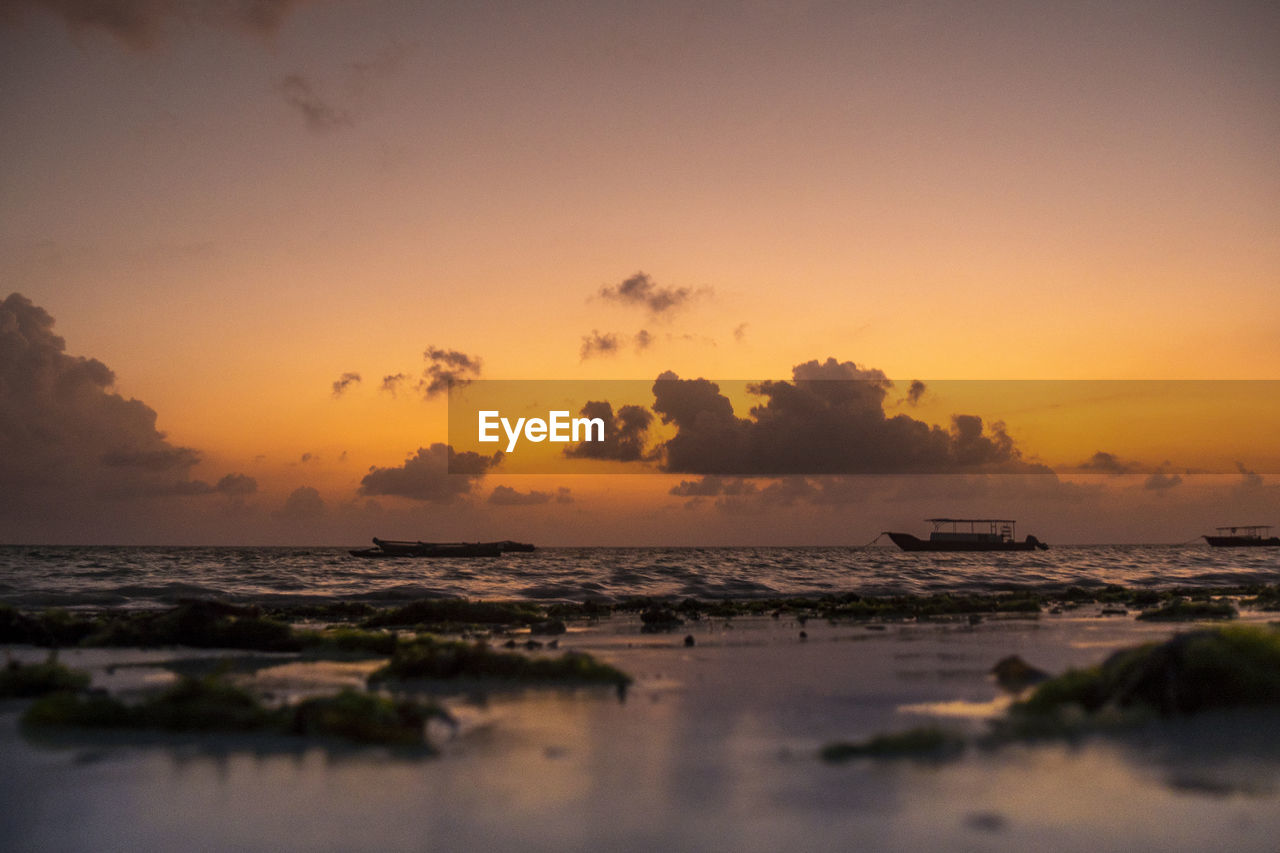 SCENIC VIEW OF SEA DURING SUNSET