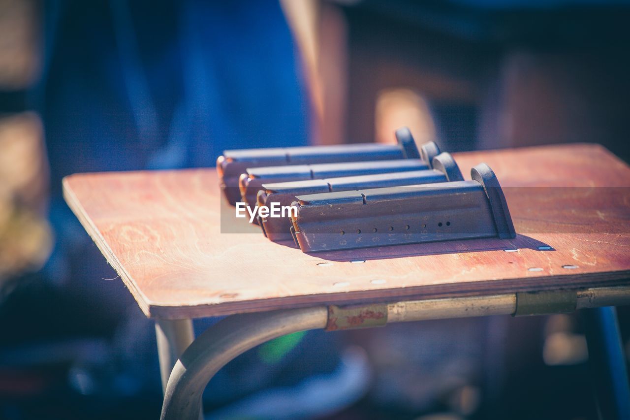 Close-up of gun ammunition on table