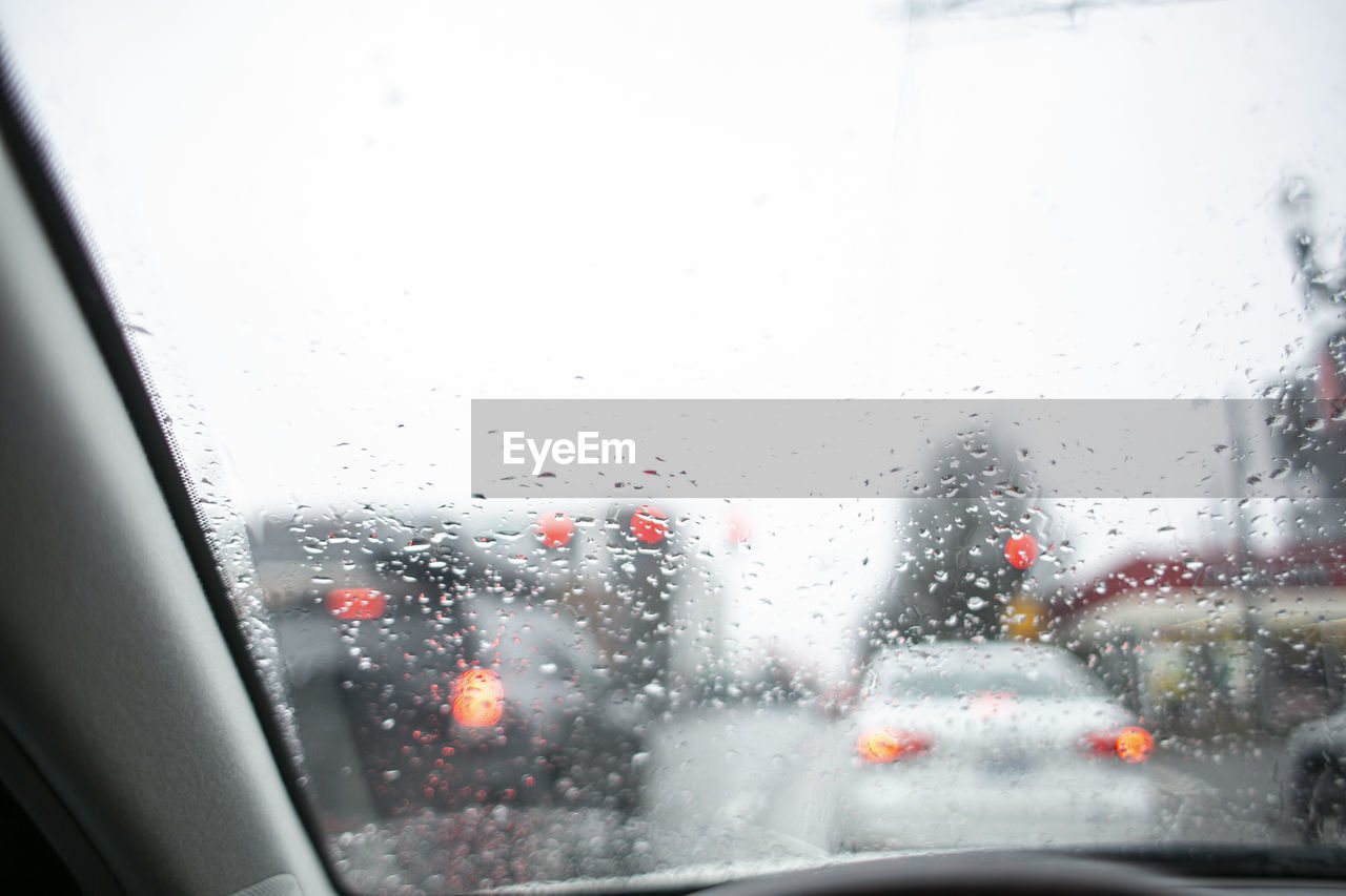 Cars seen through wet glass window