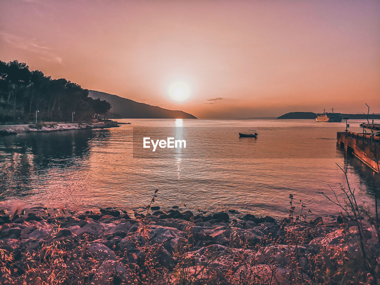 Scenic view of sea against sky during sunset