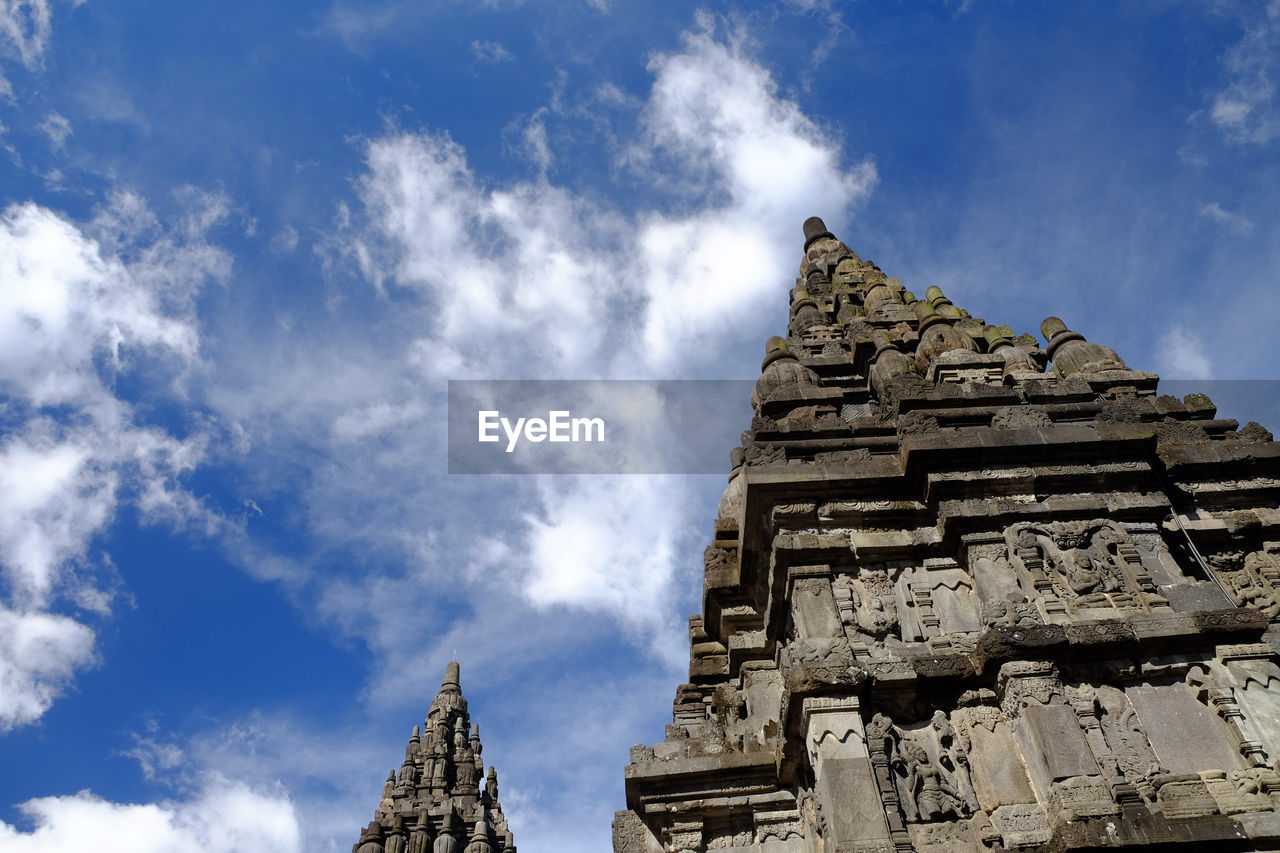 LOW ANGLE VIEW OF TEMPLE AGAINST BUILDING