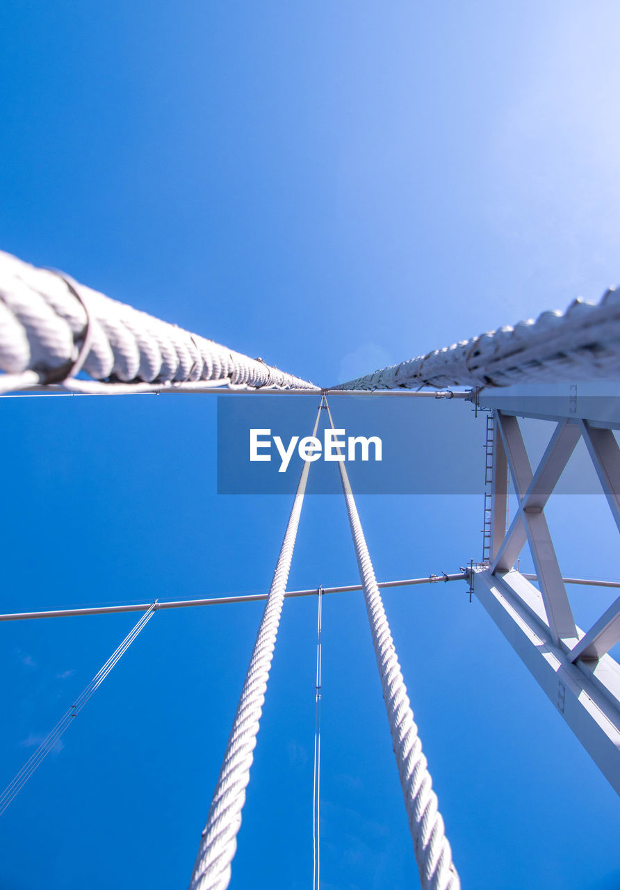 LOW ANGLE VIEW OF BRIDGE AGAINST CLEAR SKY