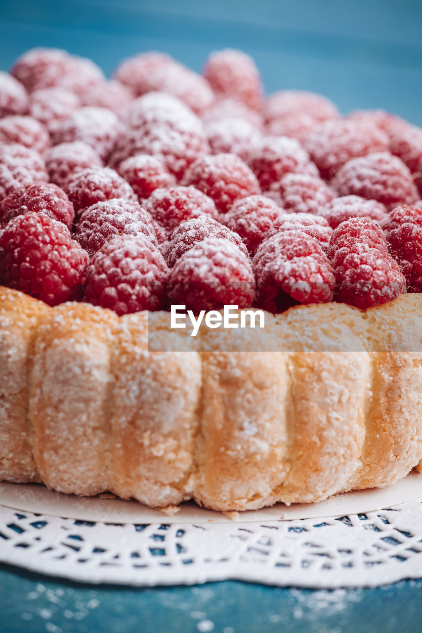 CLOSE-UP OF CAKE WITH STRAWBERRIES