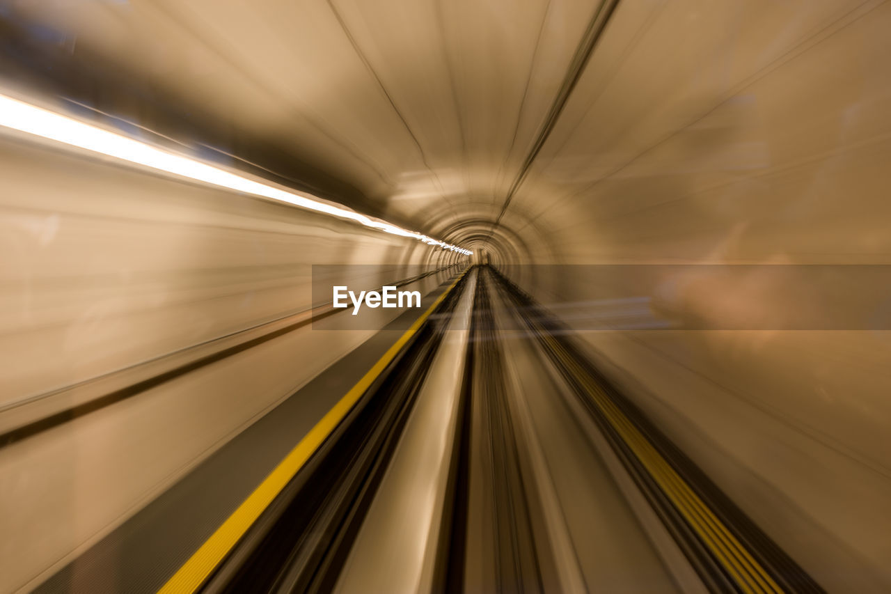 Blurred motion of train moving in tunnel