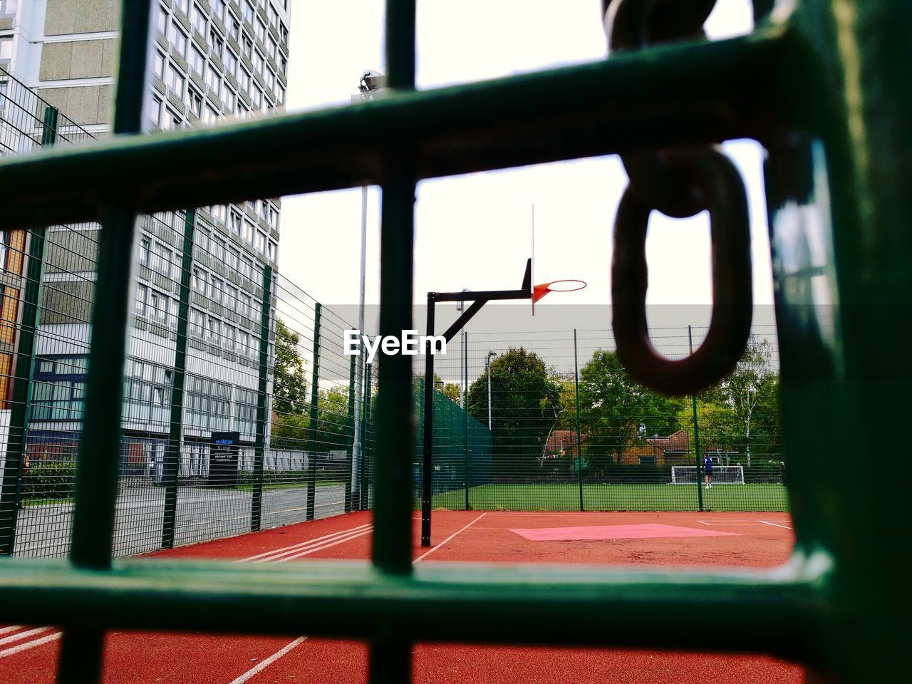 CLOSE-UP VIEW OF BASKETBALL HOOP AGAINST SKY