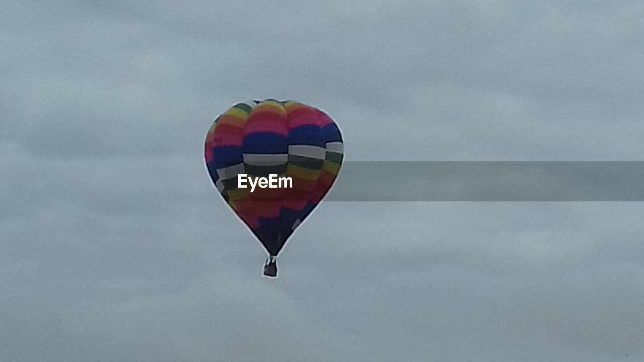 LOW ANGLE VIEW OF HOT AIR BALLOONS AGAINST SKY