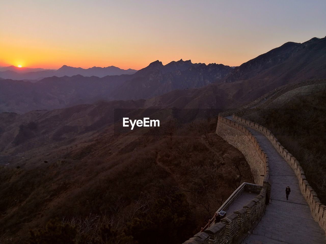 Scenic view of mountains against sky during sunset