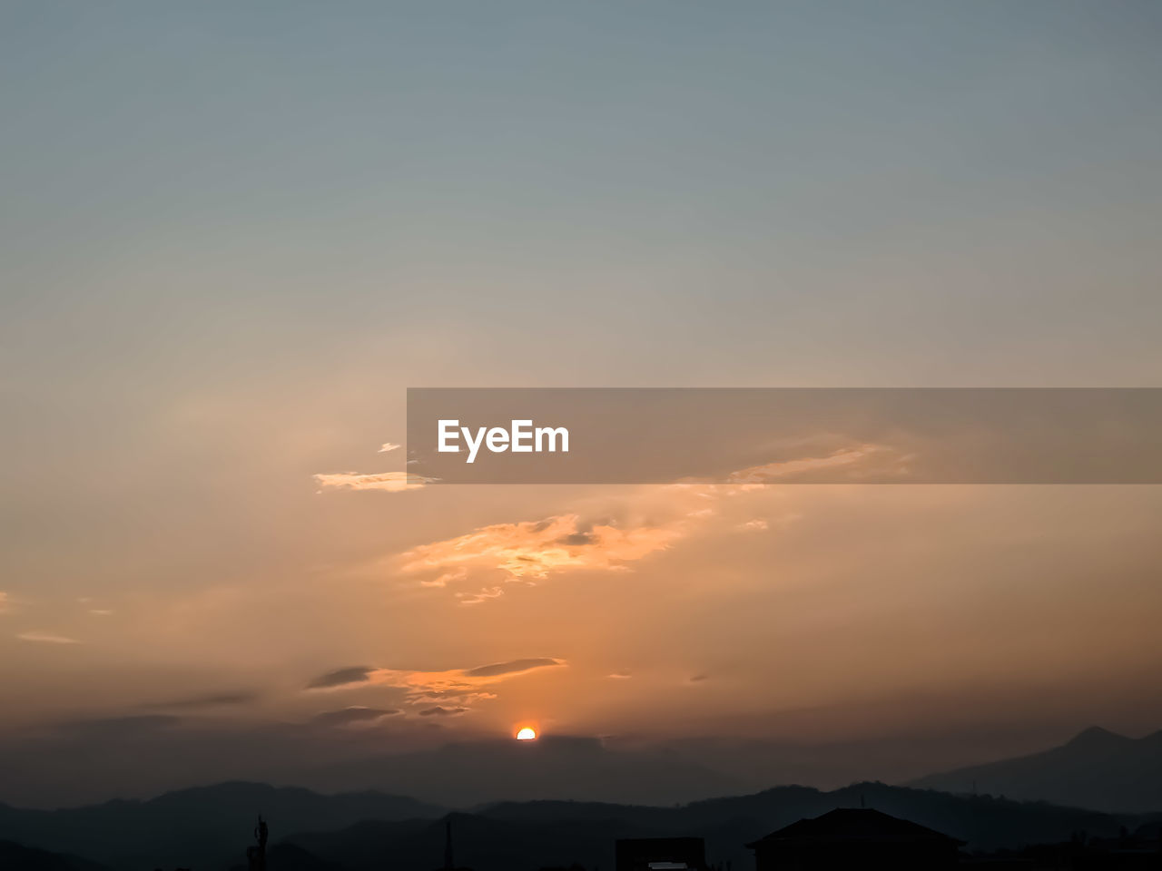 LOW ANGLE VIEW OF SILHOUETTE MOUNTAIN AGAINST ROMANTIC SKY