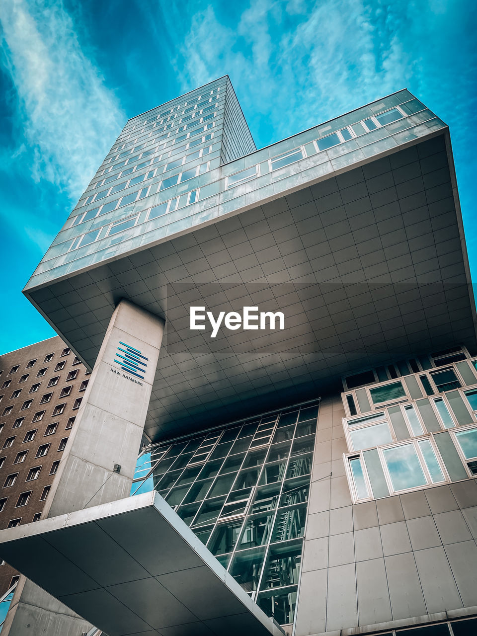 architecture, built structure, building exterior, skyscraper, blue, city, building, facade, office building exterior, sky, landmark, business, nature, stadium, finance, office, cloud, glass, low angle view, futuristic, daylighting, no people, tower block, outdoors, reflection, headquarters, sport venue, travel destinations, day
