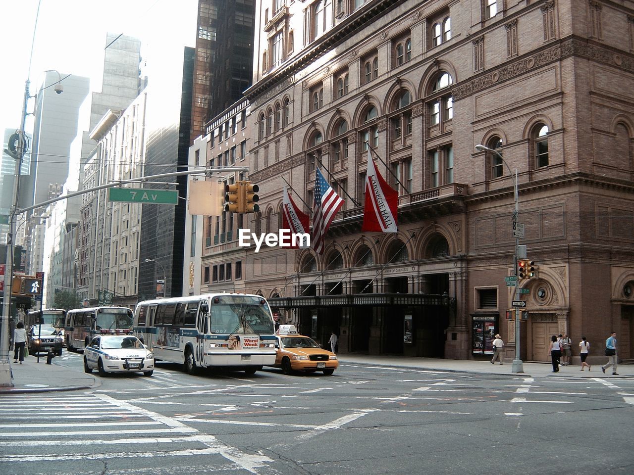 Vehicles on road along buildings