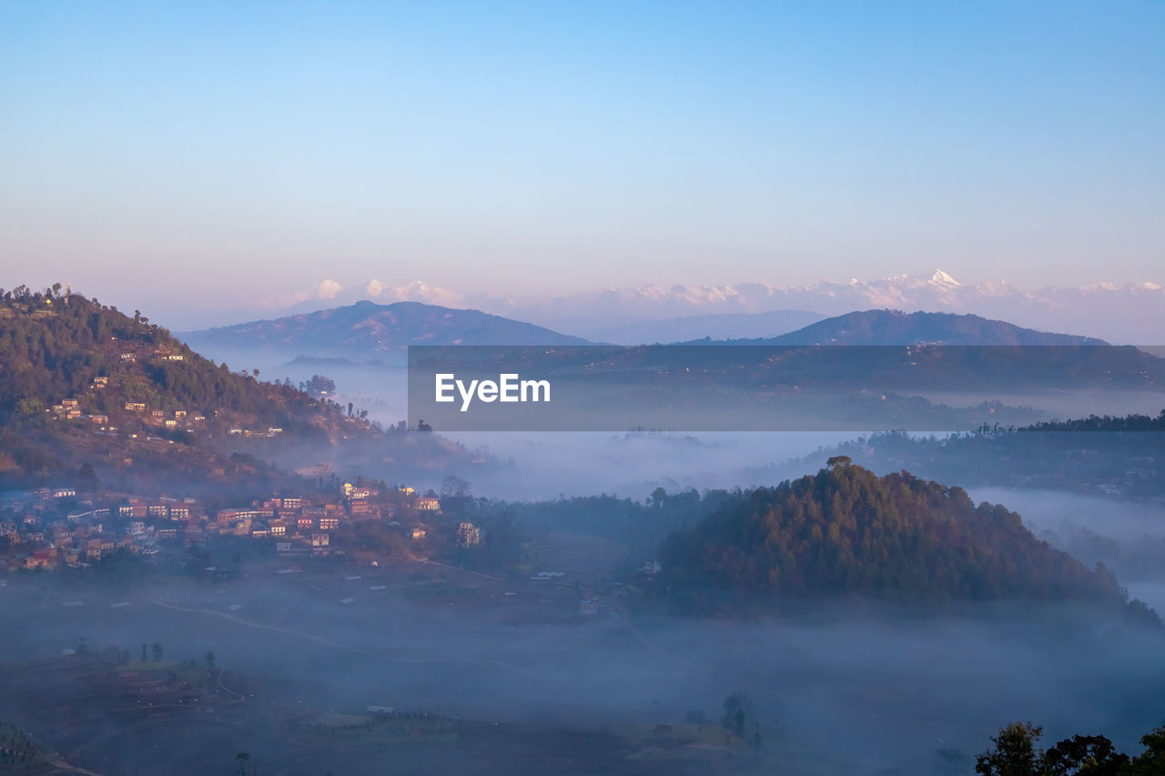 Scenic view of mountains against sky during sunset