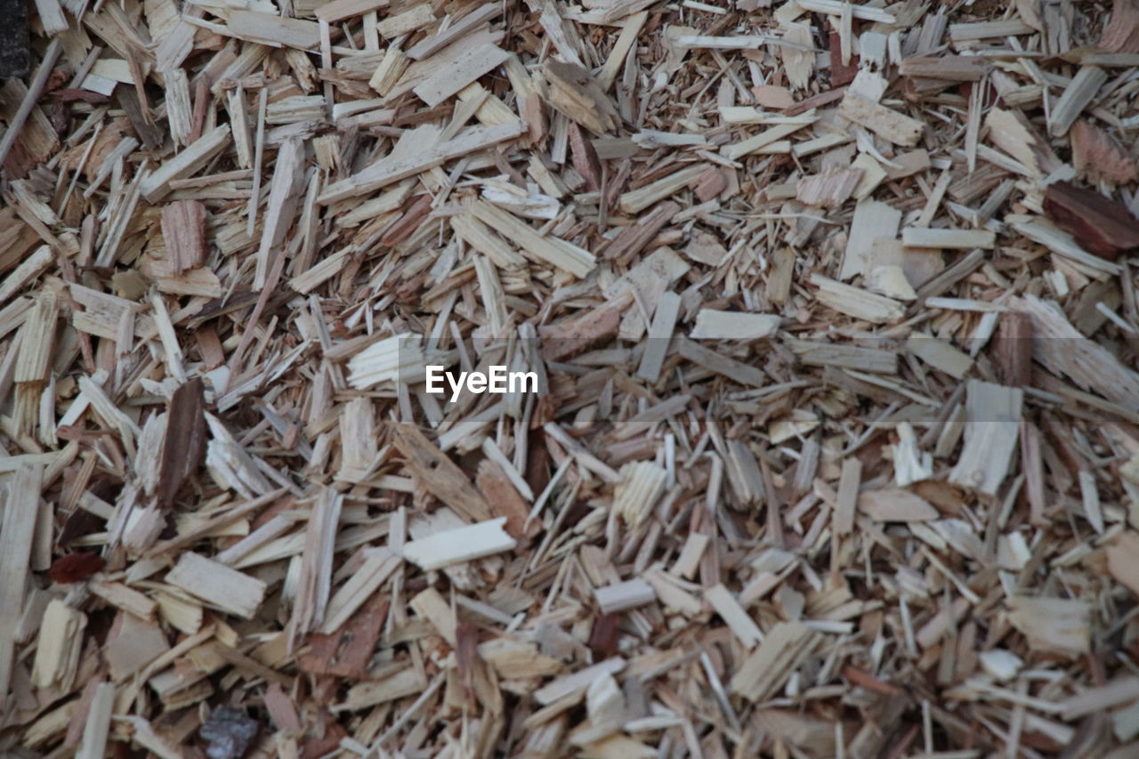 FULL FRAME SHOT OF DRIED WOOD ON WOODEN FLOOR