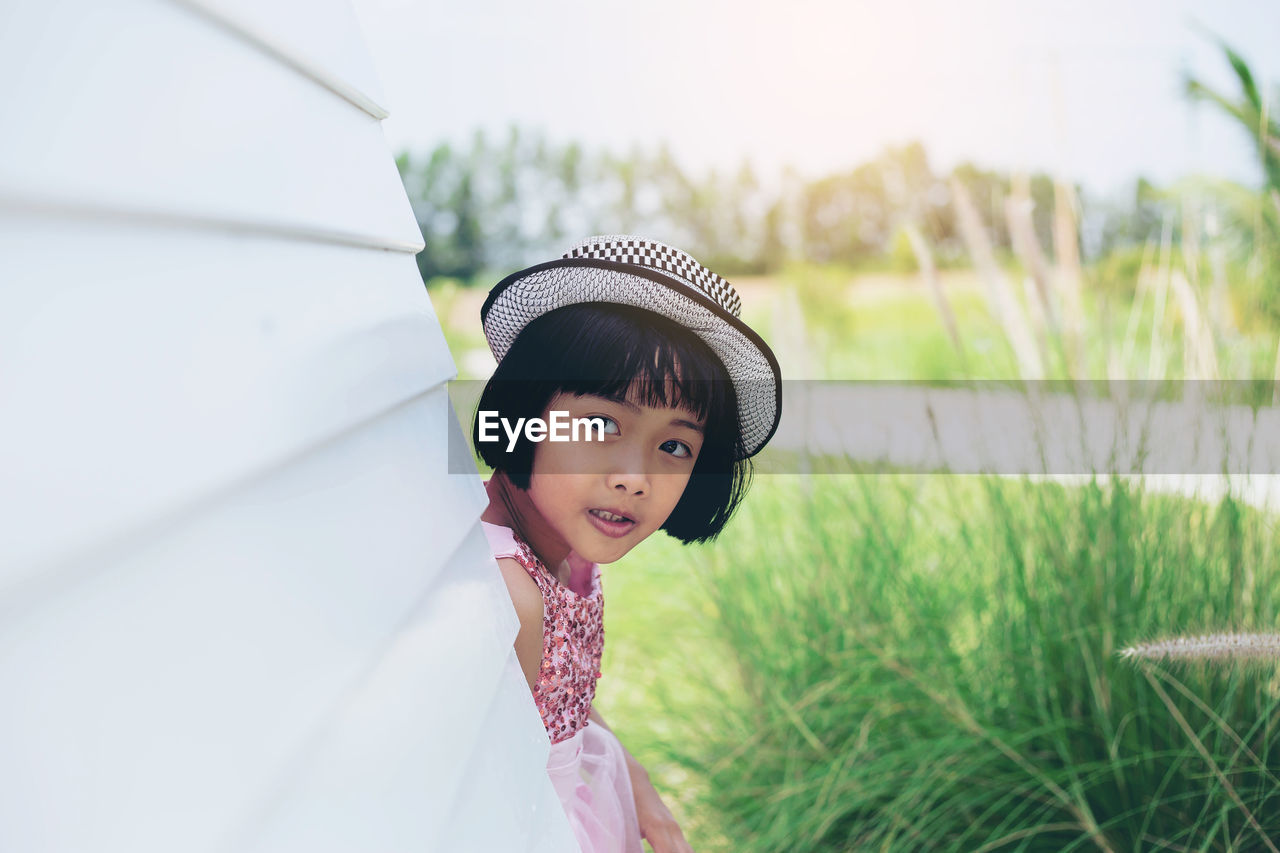 Portrait of cute girl standing outdoors