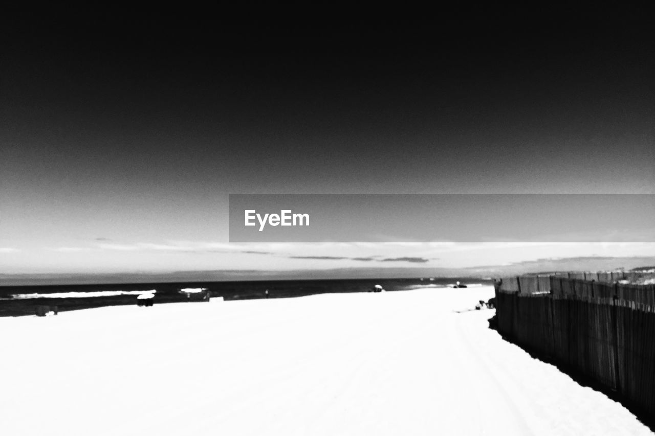 VIEW OF SNOW COVERED LANDSCAPE