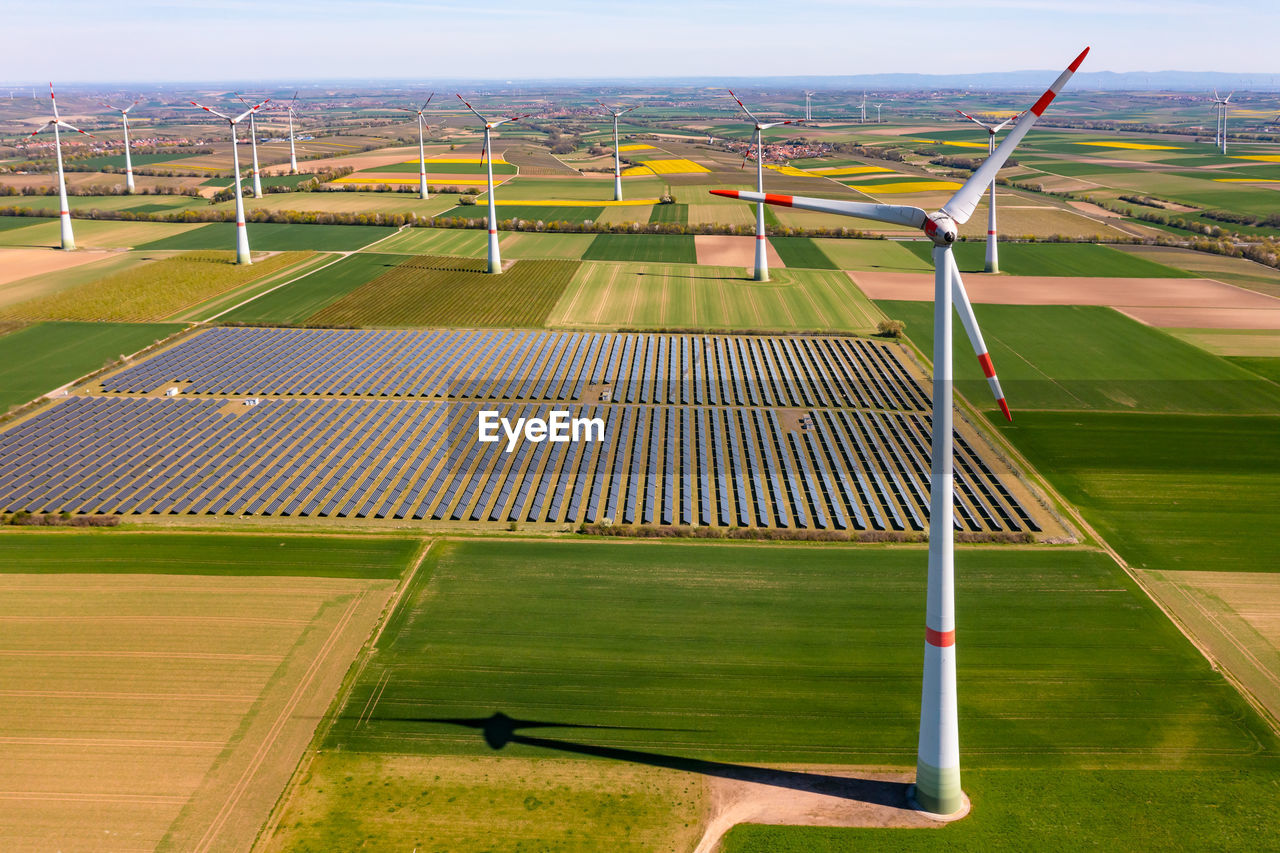 A bird's-eye view of green electricity from ground-mounted solar systems and wind turbines, germany