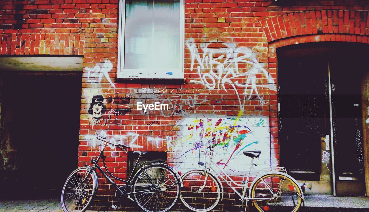 BICYCLE AGAINST MULTI COLORED WALL