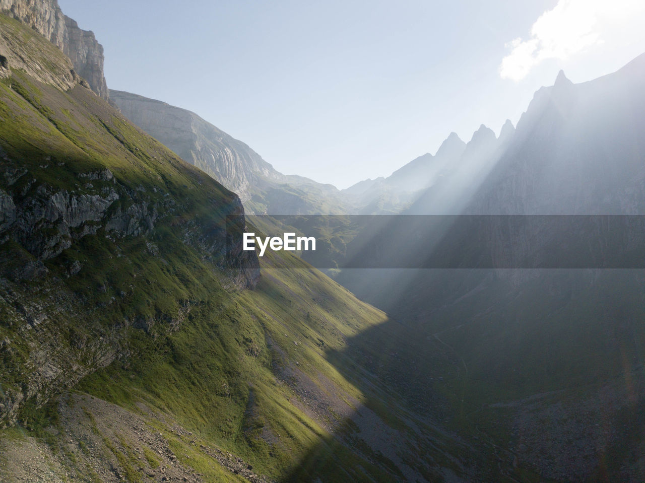 PANORAMIC VIEW OF MOUNTAINS AGAINST CLEAR SKY