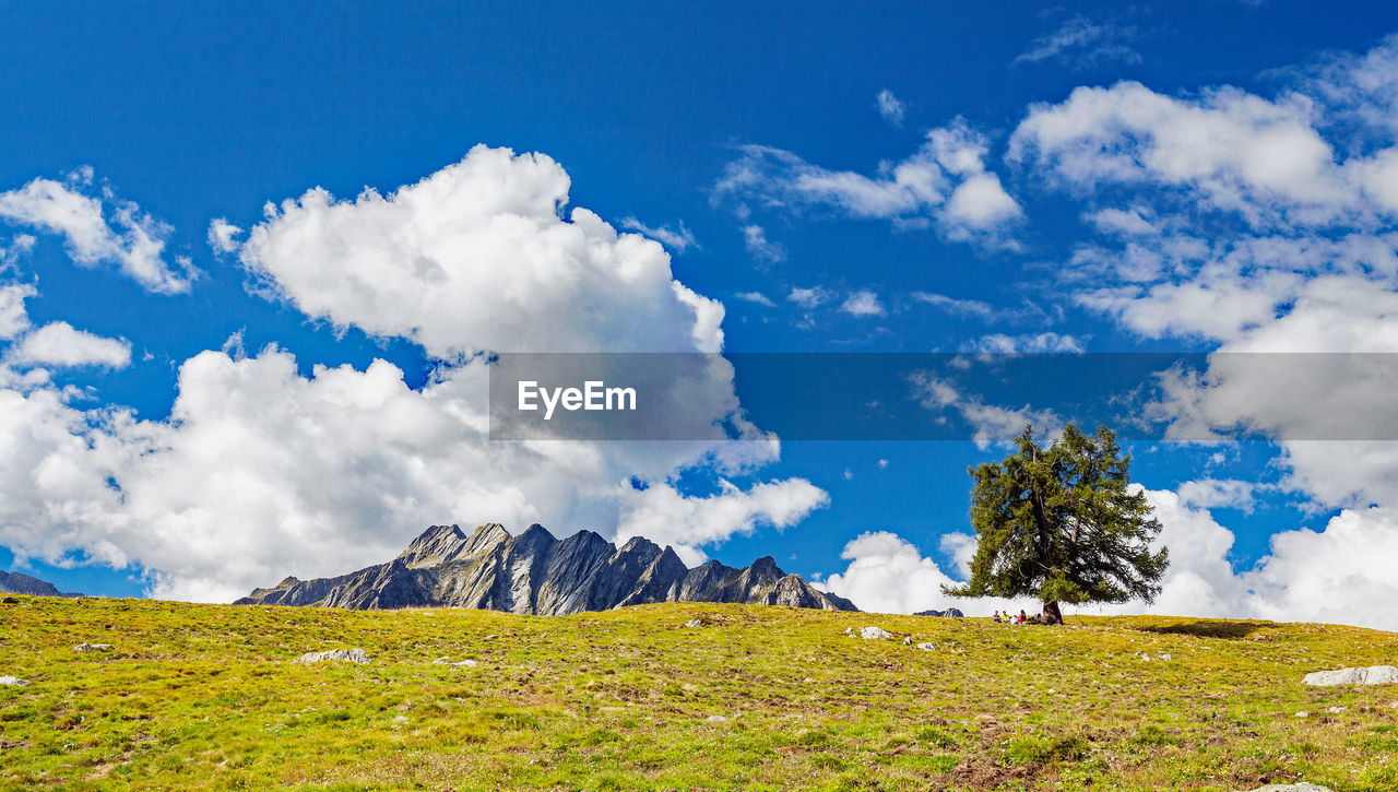 SCENIC VIEW OF LANDSCAPE AGAINST BLUE SKY