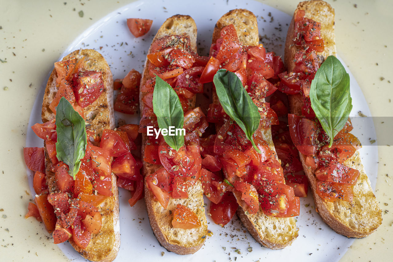 Bruschetta with tomato and basil. isolated image