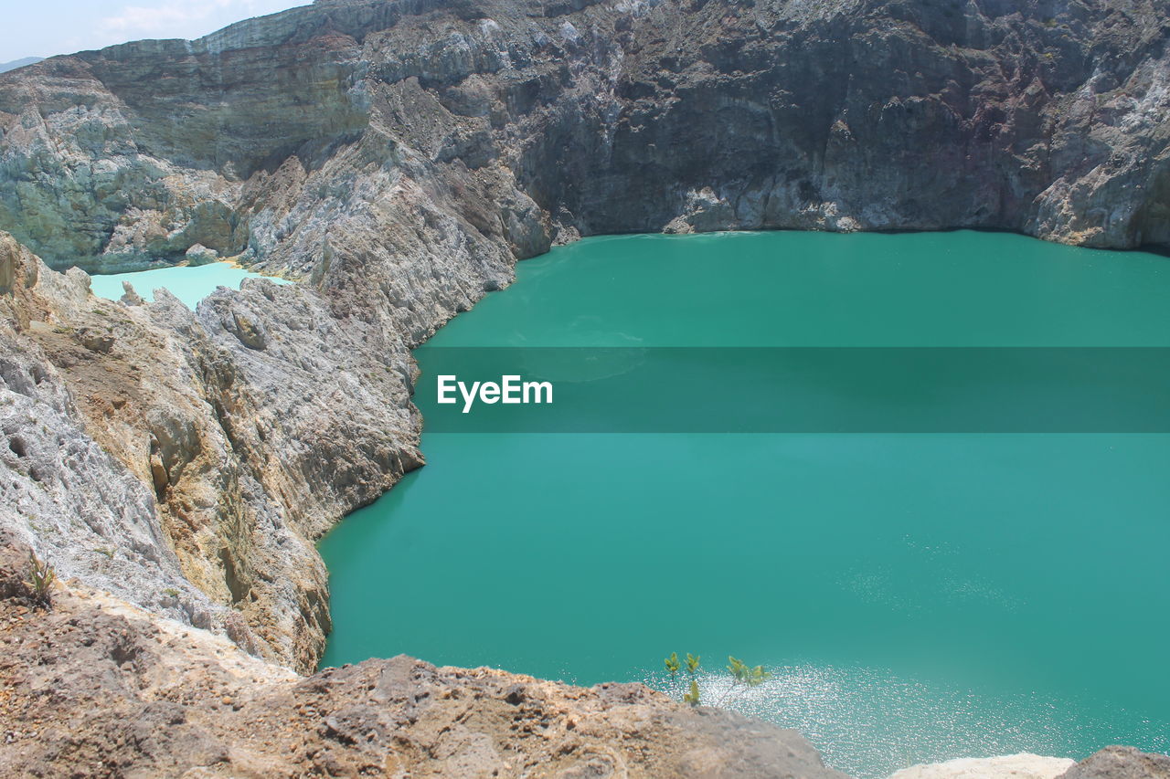 Scenic view of sea with mountains in background