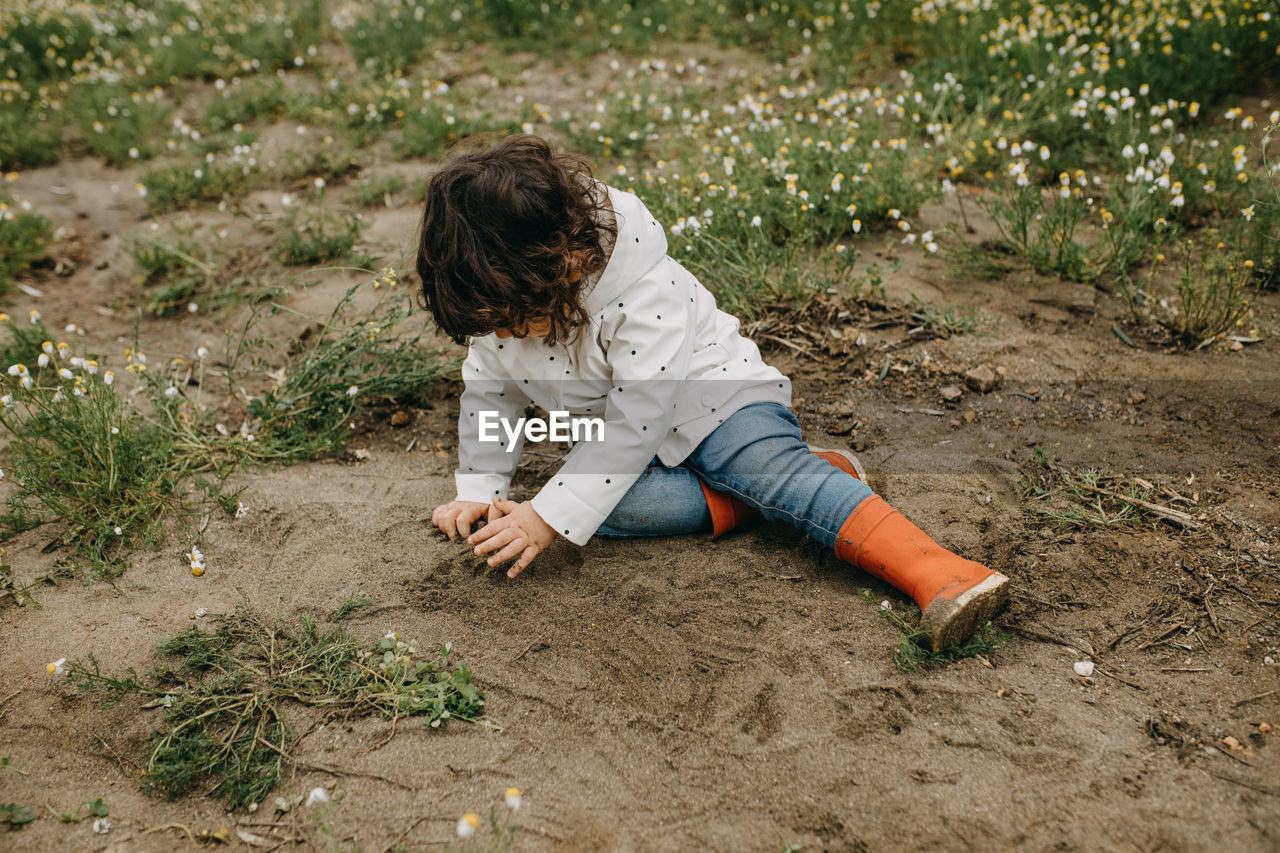 High angle view of girl playing on field