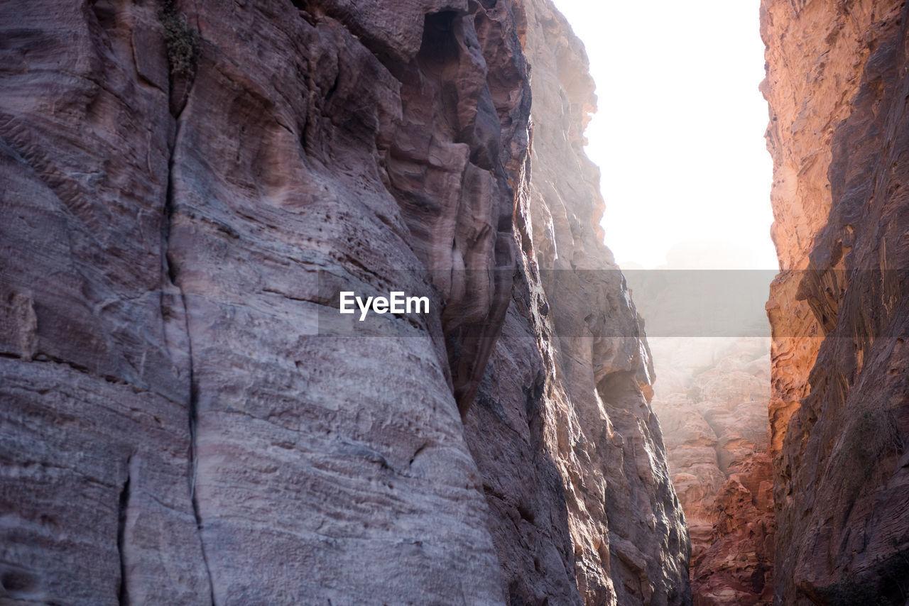 Sun streams through a richly-colored canyon