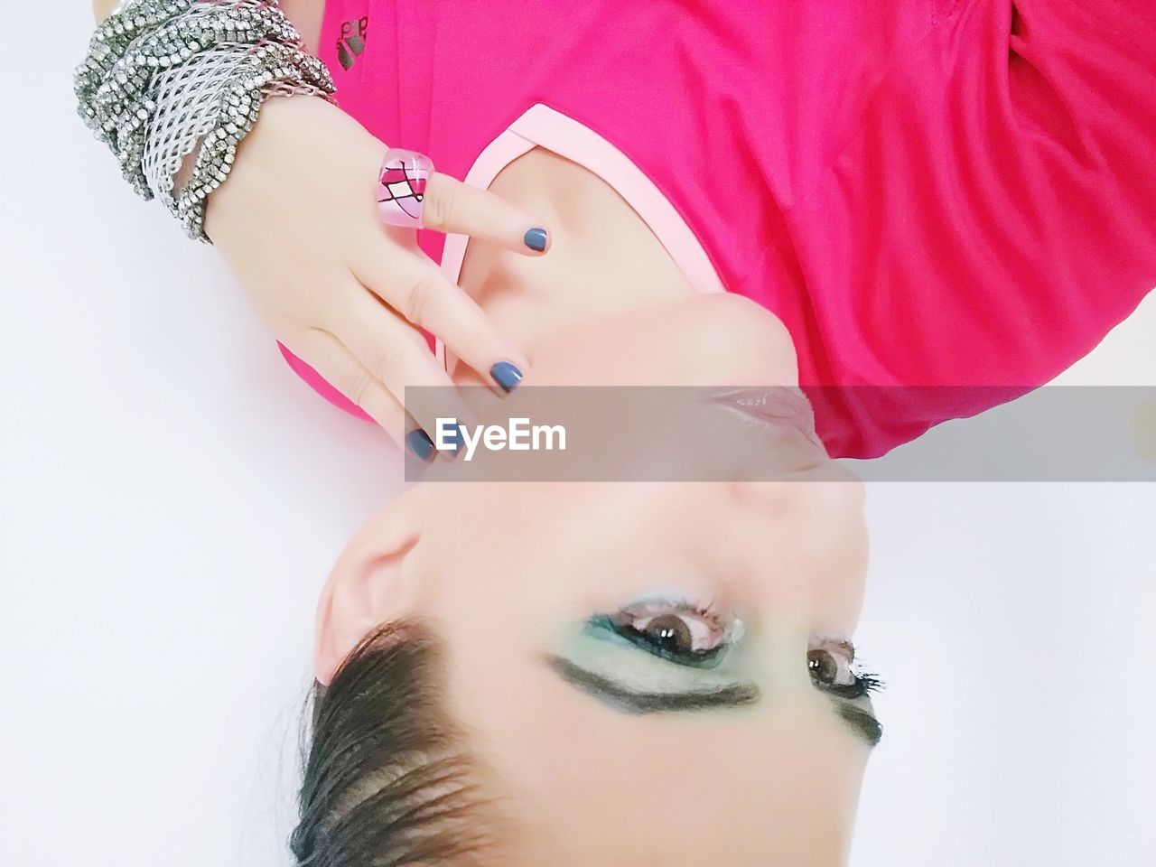 Upside down image women with eyeshadow