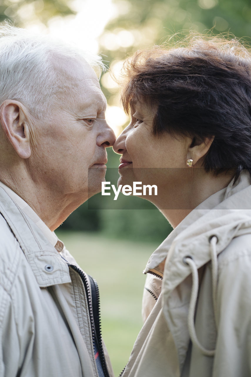 Profile of senior couple rubbing noses