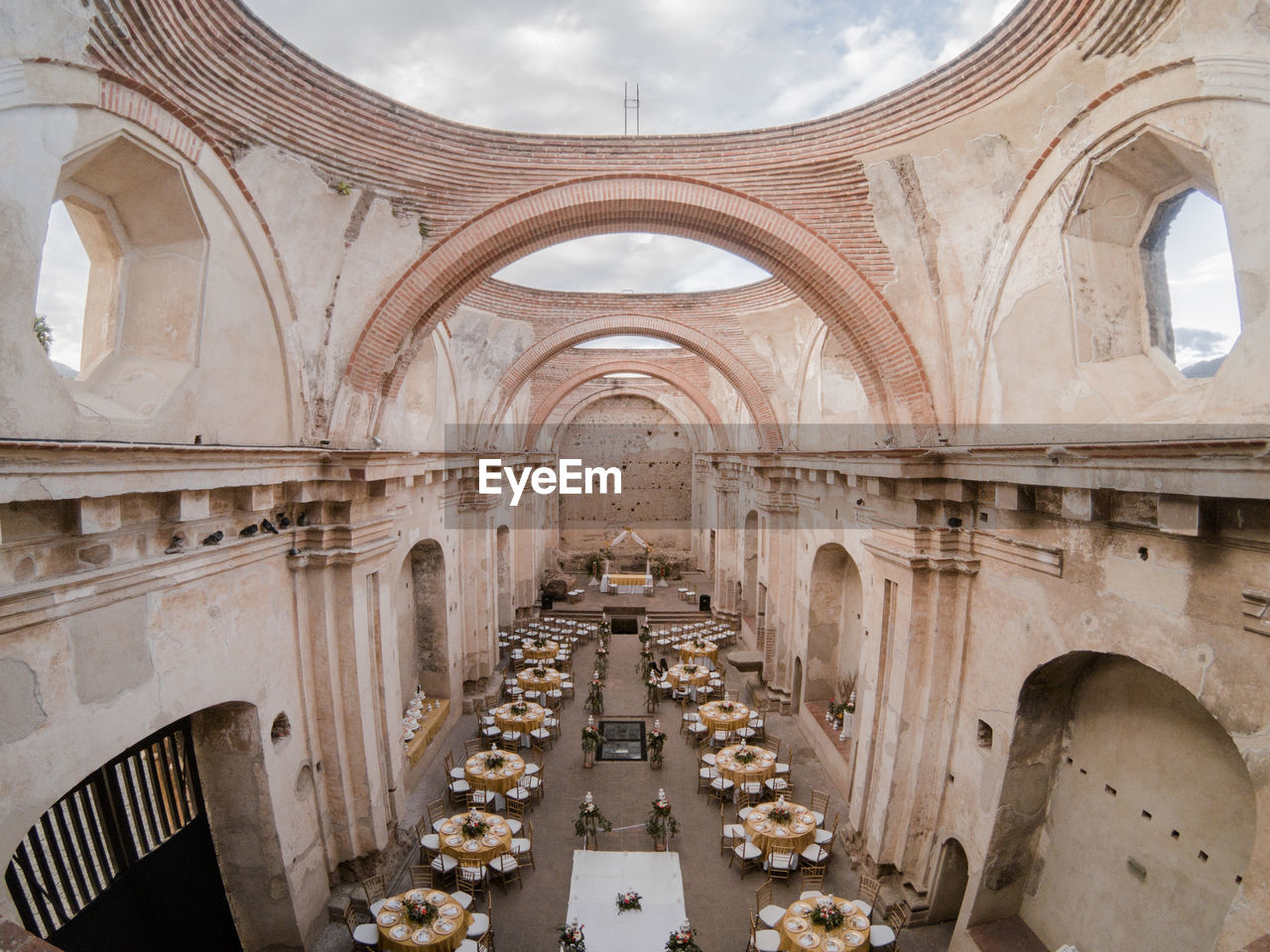 High angle view of tables and chairs arranged in historic restaurant