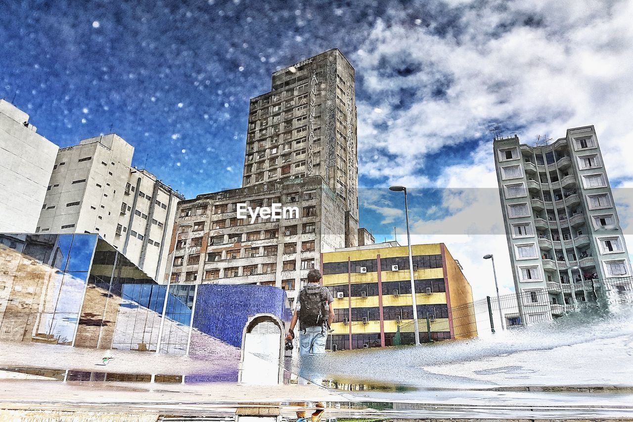 LOW ANGLE VIEW OF MODERN BUILDINGS AGAINST SKY