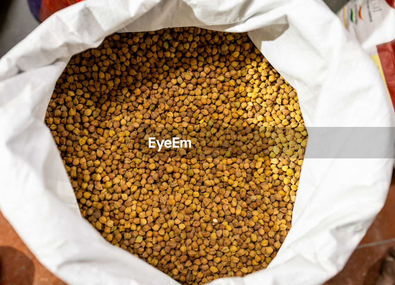 Black chickpeas or kala chana for sale at retail shop from top angle at day