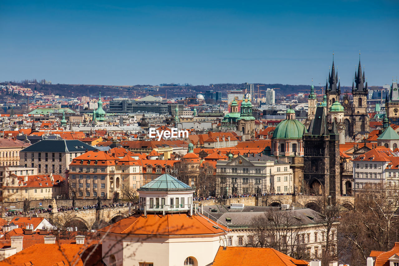 Charles bridge and prague city old town seen from petrin hill in a beautiful early spring day