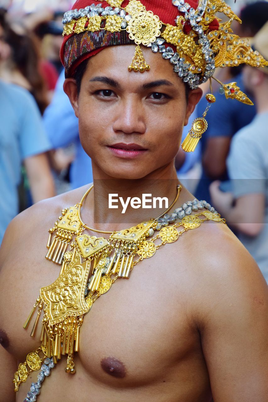 CLOSE-UP PORTRAIT OF SHIRTLESS YOUNG WOMAN WITH MASK