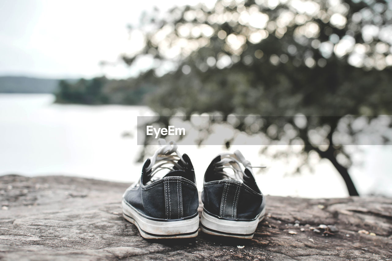 Close-up of black canvas shoes