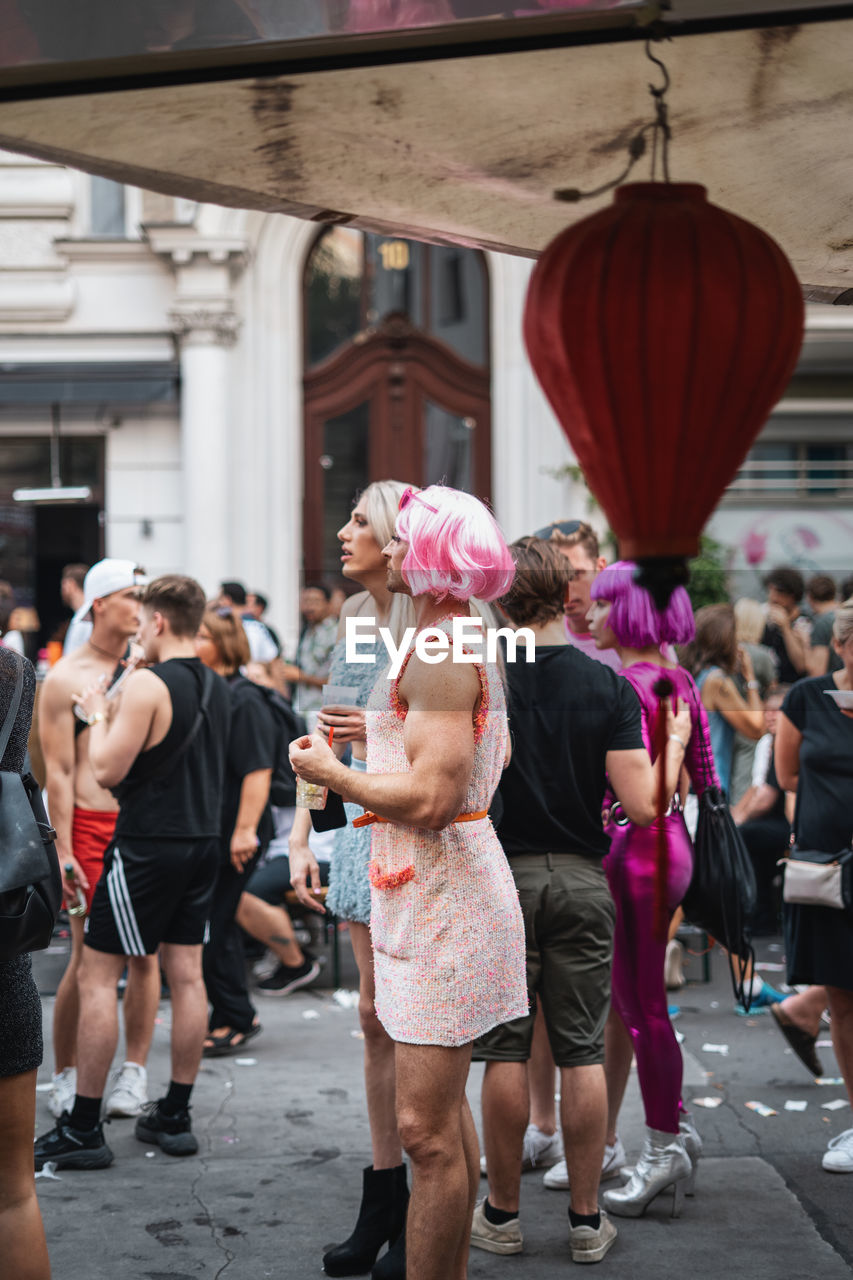 GROUP OF PEOPLE WALKING IN STREET