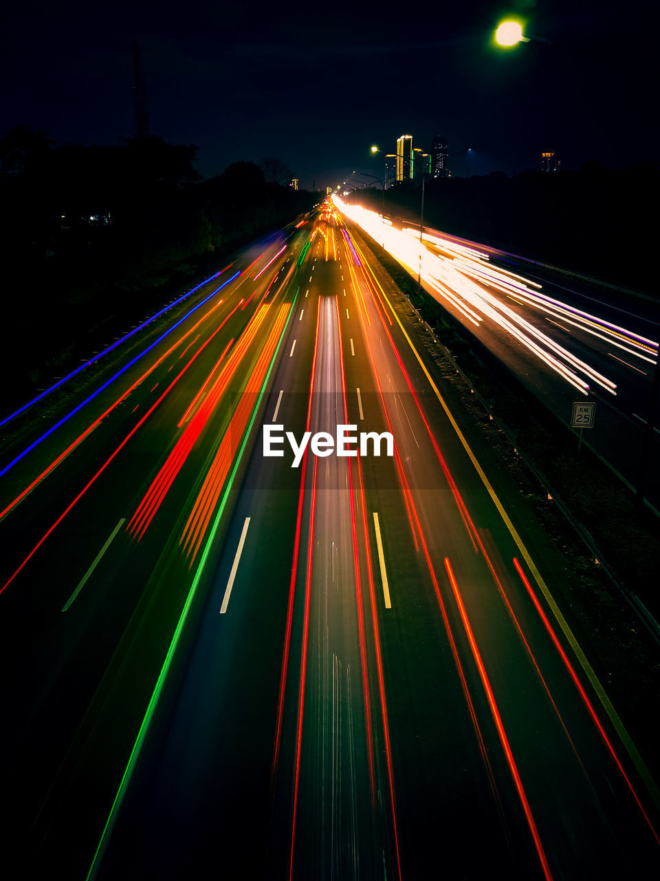 High angle view of light trails on road at night