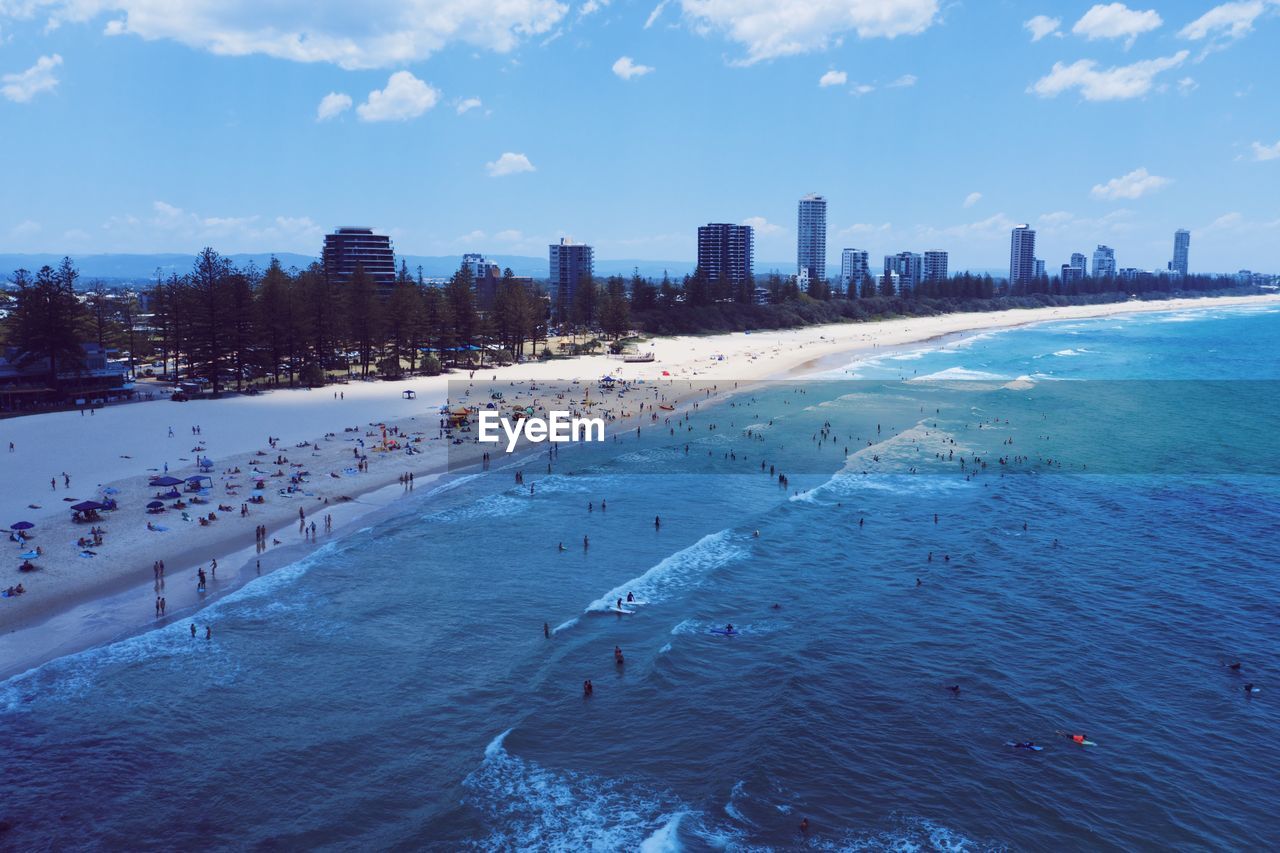 Panoramic view of sea and buildings against sky