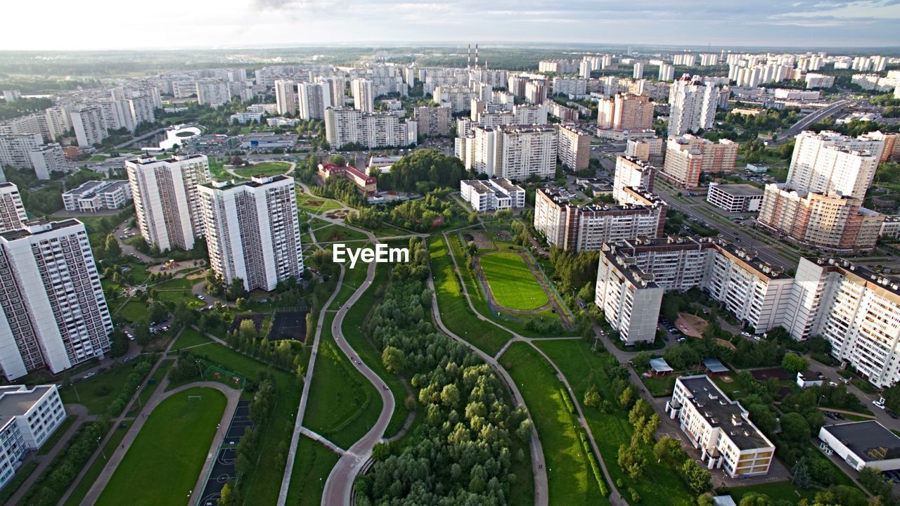 High angle view of buildings in city against sky