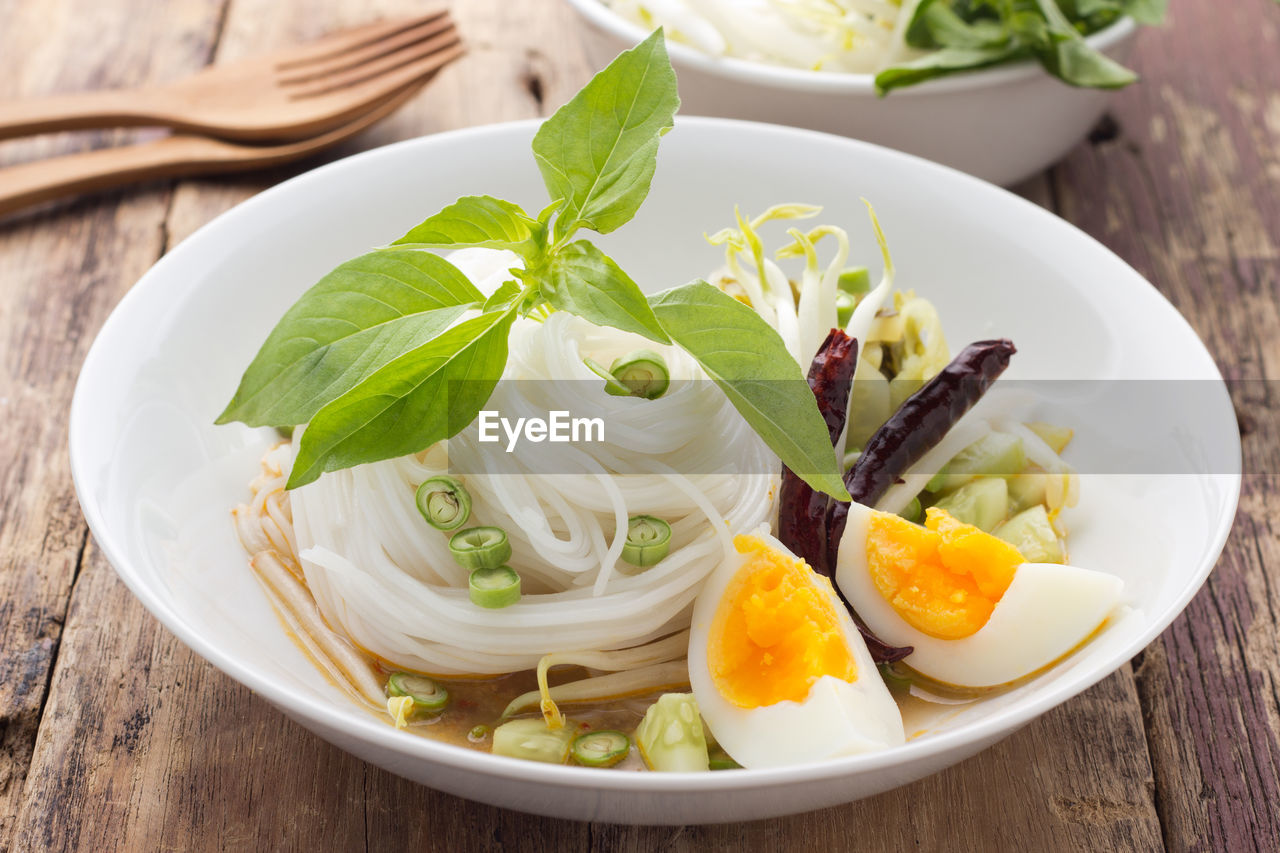 Close-up of kanomjin in bowl on table