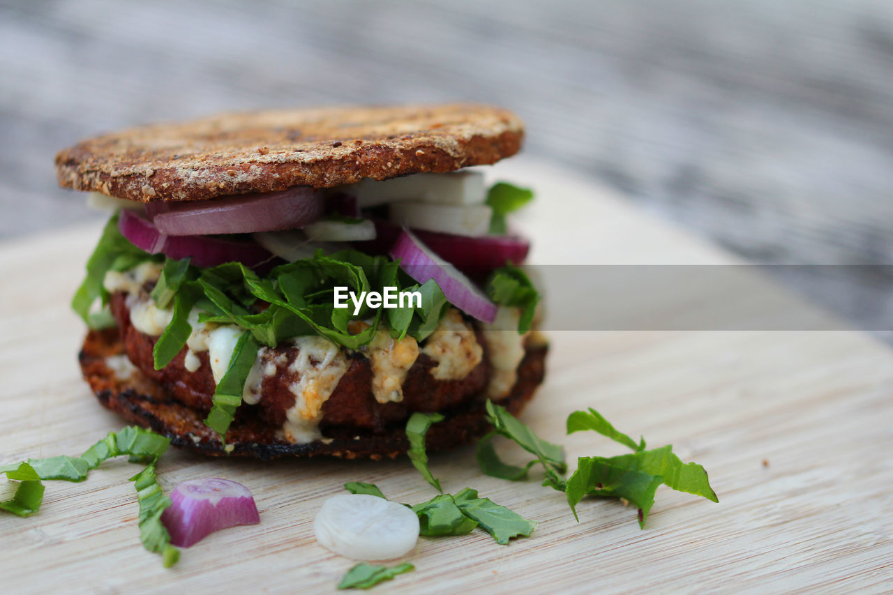 Burger vegan,with pattie of pea protein and arugula naturally meatless delicious and healthy