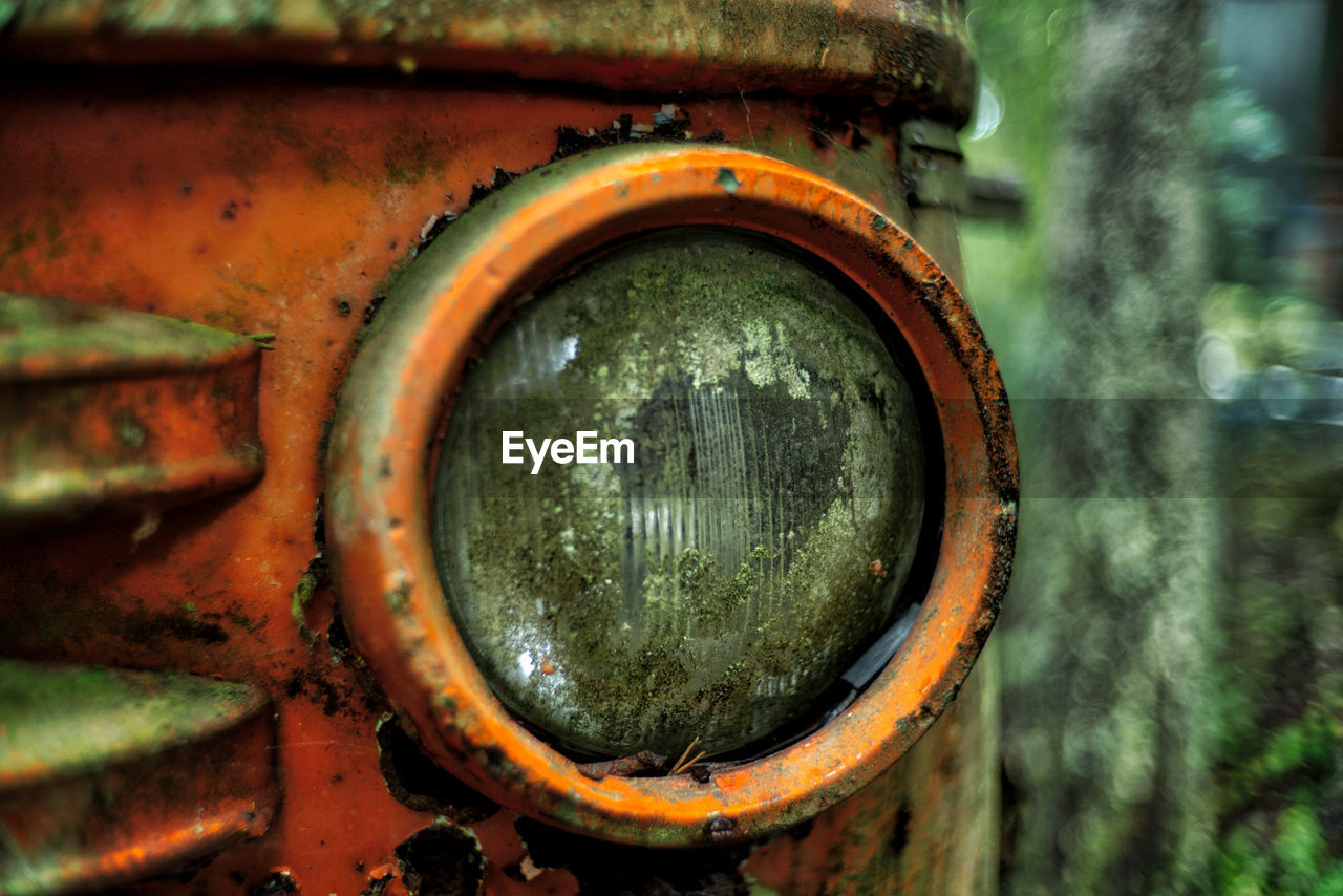 Close-up of abandoned rusty vehicle