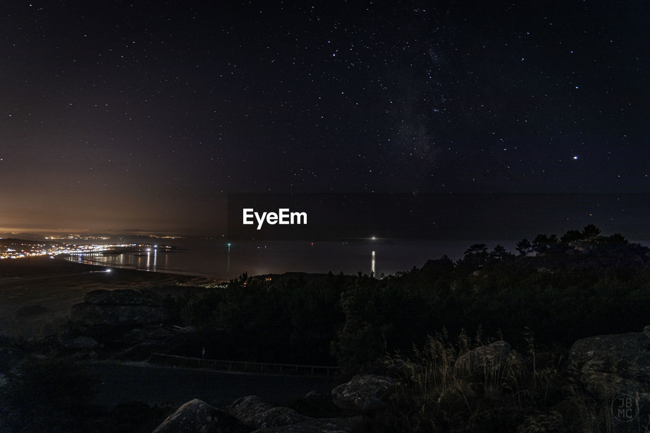 SCENIC VIEW OF ILLUMINATED SKY AT NIGHT