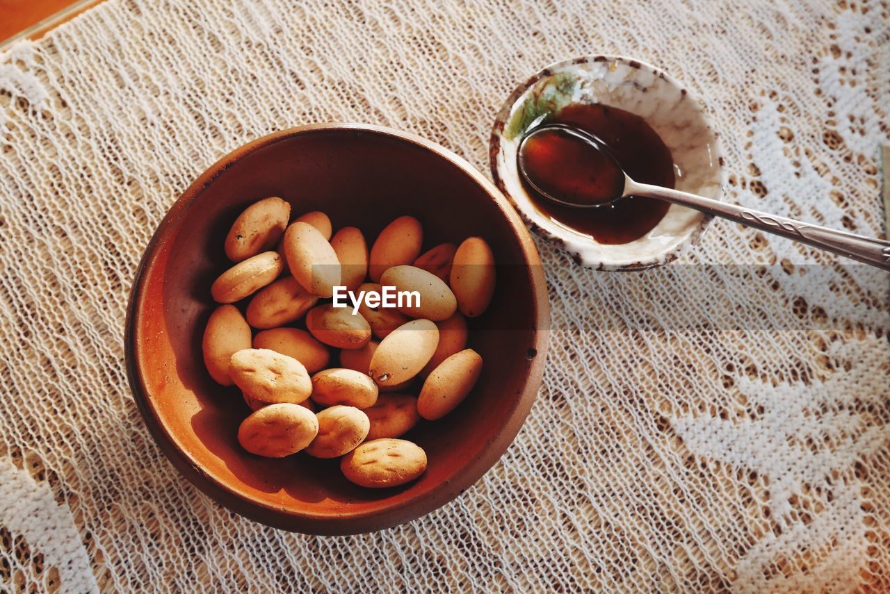 High angle view of breads with honey on table